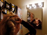 Skyla Lynk-Romano,15, prepares her hair as she readies herself for her first day of school.  Skyla Lynk-Romano who suffered a traumatic brain injury when she was struck by a car on January 5th attends her first day of school at the Greater New Bedford Regional Vocational Technical High School after a long rehabilitation process at the Pappas Rehabilitation Hospital for Children in Canton, MA. On January 5, 2017, Skyla, a freshman at Greater New Bedford Regional Vocational-Technical High School, was crossing Dartmouth Street to meet her father after leaving the Dancer’s Edge studio when she was hit by a car and critically injured. The driver, Jessica Skaggs, 34, fled the scene before turning herself in. Skaggs has been sentenced to six months at the House of Corrections, but the sentense was suspended for two years. PHOTO PETER PEREIRA